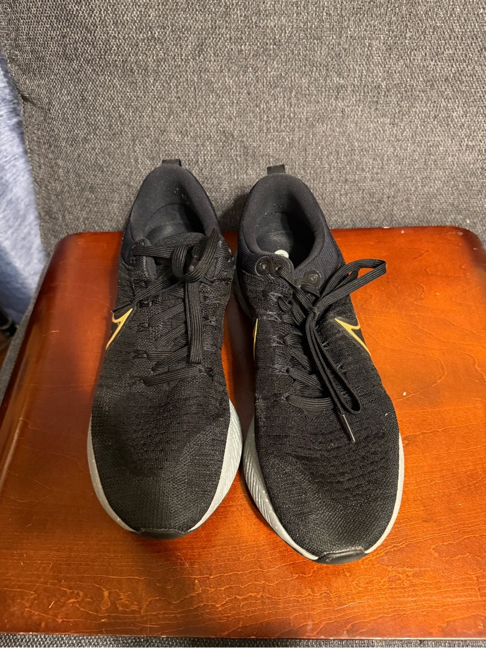 Nike Black Athletic Running Sneakers with Gold Swoosh